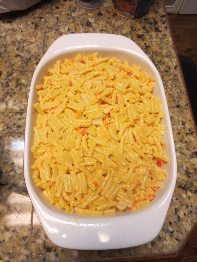 casserole dish filled with the mac 'n cheese + tuna + pepper mixture